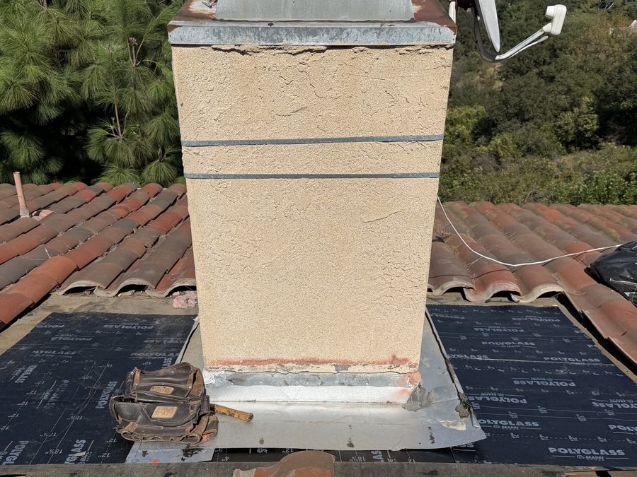 New chimney flashing over fresh underlayment